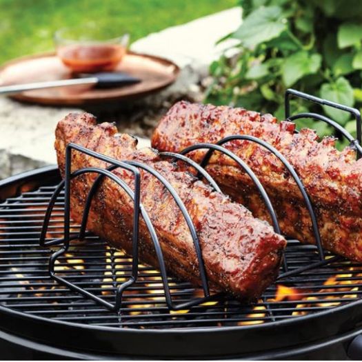 A grill with two different types of meat on it.