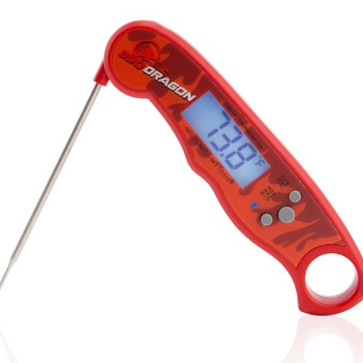 A red thermometer is on the ground