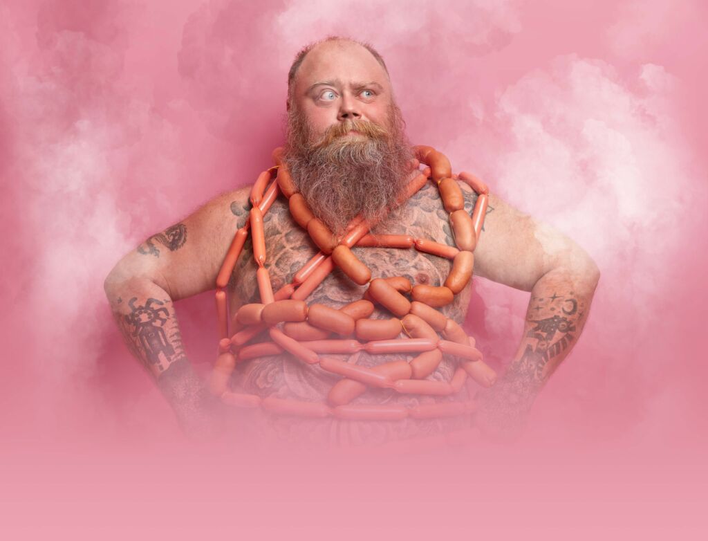 A man with sausages wrapped around his body.