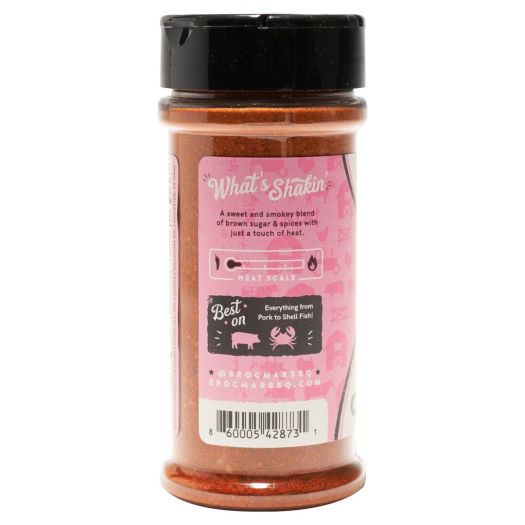 A jar of pink seasoning with black lid.