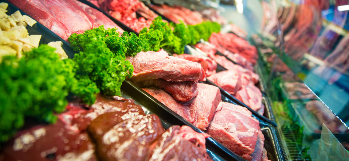 A bunch of meat on display at the store
