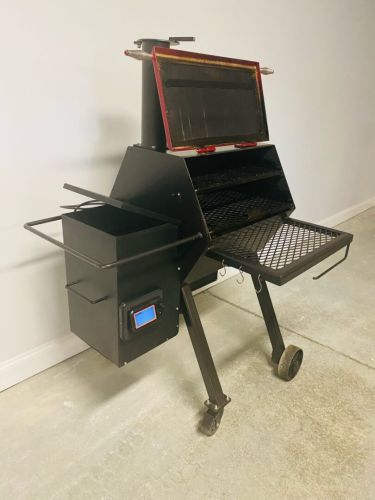 A laptop computer sitting on top of an outdoor grill.