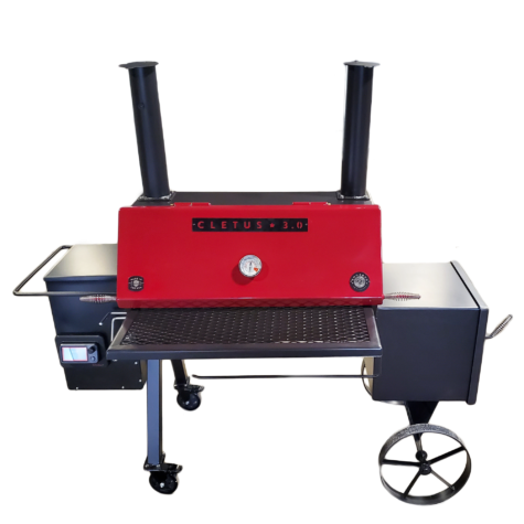 A red grill sitting on top of a black table.